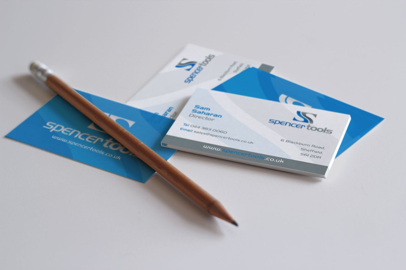 Spencer Tools business cards in blue